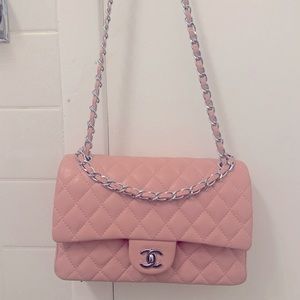 Pink, crossbody, double flap medium sized purse.